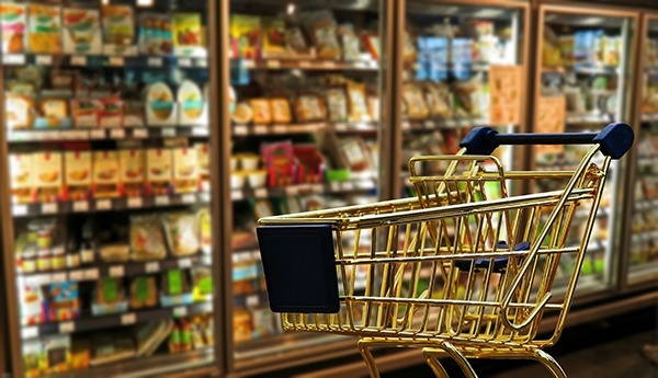 shopping cart in grocery store aisle